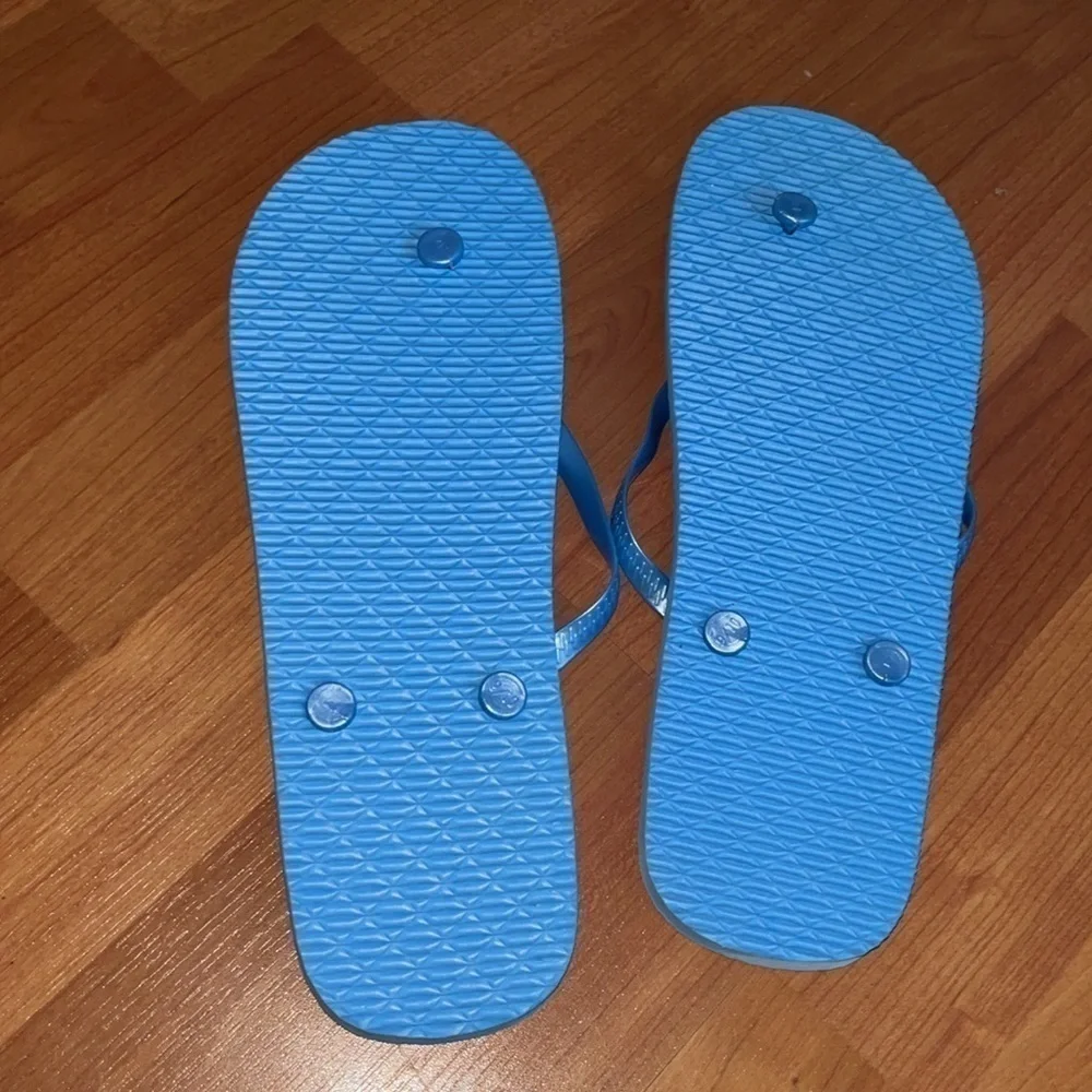 Flamingo women’s blue and pink flip flops size 9 - 10